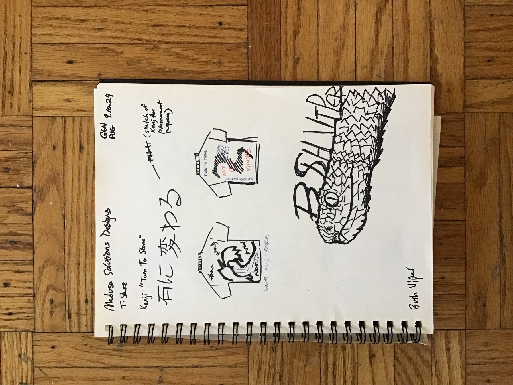 Sketchbook page with a kanji shirt direction and a serpent drawing